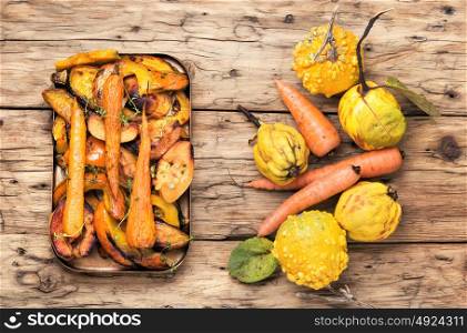 Baked pumpkin with carrots and quince. autumn vegetarian food, baked carrot, pumpkin and quince
