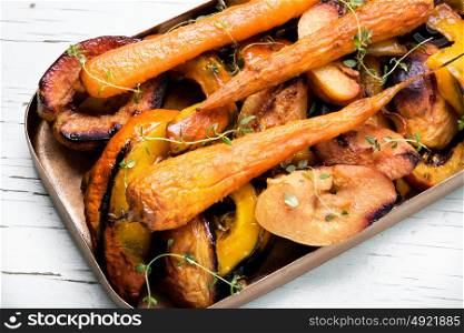 Baked pumpkin with carrots. vegetarian dish with baked carrot, pumpkin and quince