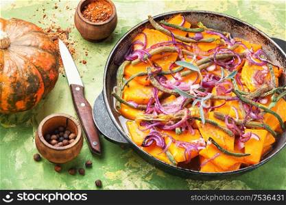 Baked pumpkin with red onion and vigna.Stewed vegetables. Homemade baked pumpkin