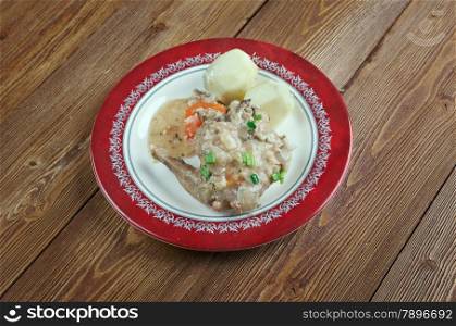 baked rabbit with vegetables. close up