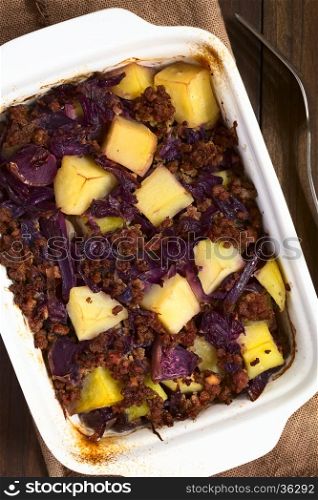 Baked red cabbage, apple, mincemeat and potato casserole in dish, photographed overhead with natural light (Selective Focus, Focus on the top of the dish)