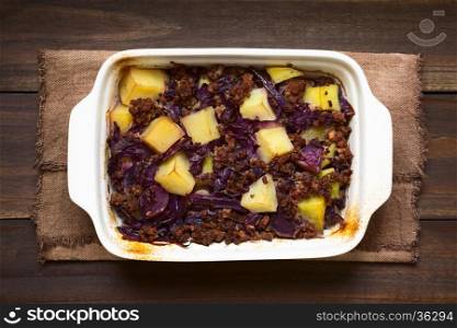 Baked red cabbage, apple, mincemeat and potato casserole in dish, photographed overhead with natural light (Selective Focus, Focus on the top of the dish)