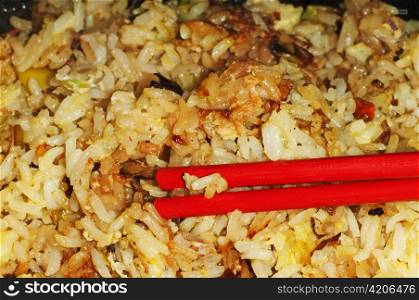 baked rice with chopsticks