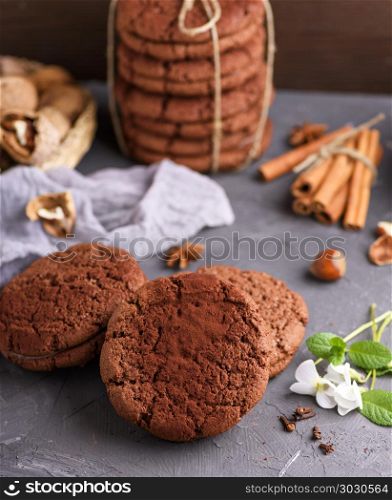 baked round chocolate chip cookies on a black background. baked round chocolate chip cookies