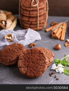 baked round chocolate chip cookies on a black background. baked round chocolate chip cookies