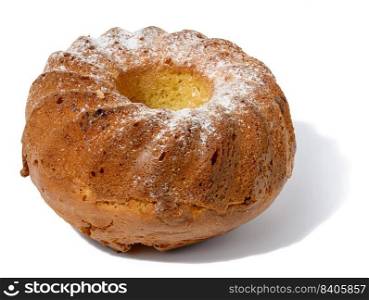 Baked round cupcake sprinkled with sugar on a white isolated background