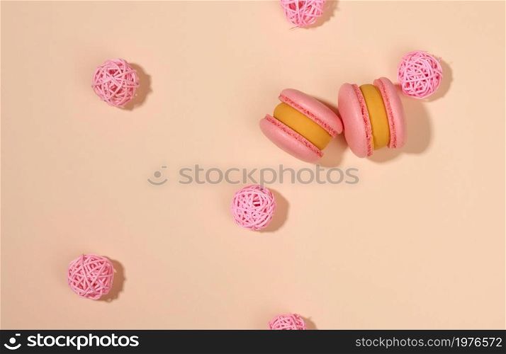 baked round macarons on a beige background, delicious dessert, top