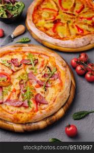 Baked round pizza made with salami, tomatoes and mushrooms