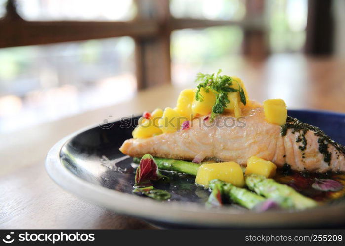 Baked salmon fillet with rosemary, lemon and mango