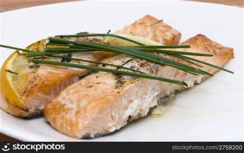 baked salmon. photo of a delicious baken salmon with chive