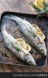 Baked sea bass with lemon and rosemary
