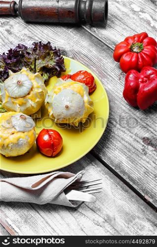 Baked squash with cheese. Autumn dish of scallops baked in cheese with tomatoes