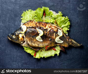 baked stuffed fish. whole fish carp baked in the oven