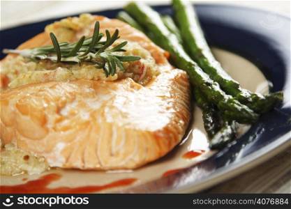 Baked stuffed salmon with asparagus on the side