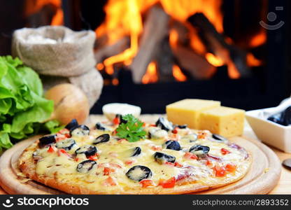 baked tasty pizza near wood oven