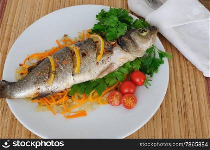 Baked trout with lemon onion and carrot on a pillow