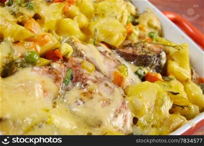 Baked trout with potatoes in casserole