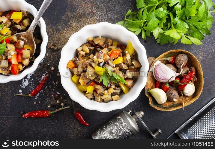 baked vegetables in white bowl on a table