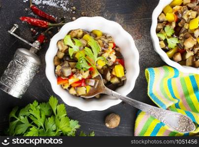 baked vegetables in white bowl on a table