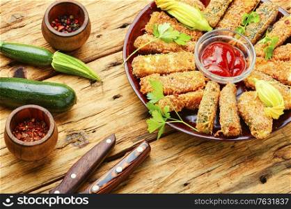 Baked zucchini sticks with sauces,roasted zucchini.Breaded fried zucchini. Zucchini sticks in breadcrumbs
