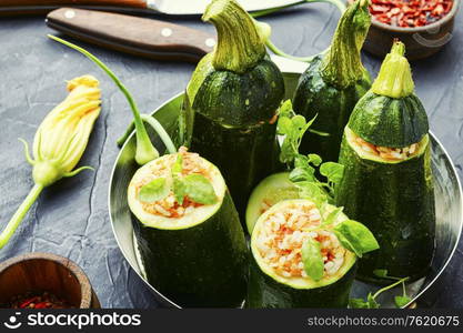 Baked zucchini stuffed with carrot and rice. Zucchini stuffed with rice