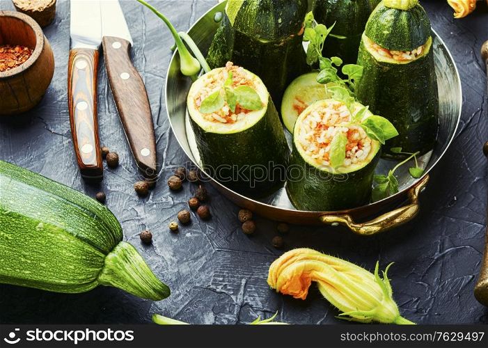 Baked zucchini stuffed with carrot and rice. Zucchini stuffed with rice