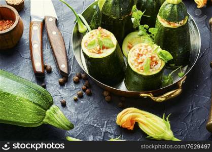 Baked zucchini stuffed with carrot and rice. Zucchini stuffed with rice