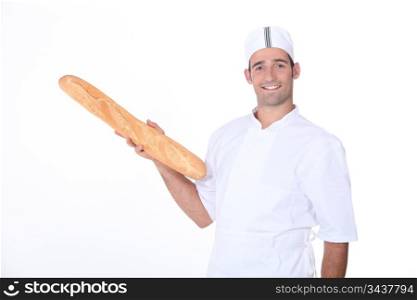 Baker holding fresh baguette