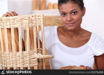 Baker posing with her bread