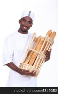 Baker with a basket of baguettes