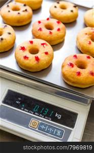 bakery doughnuts with assorted filling on metal tray