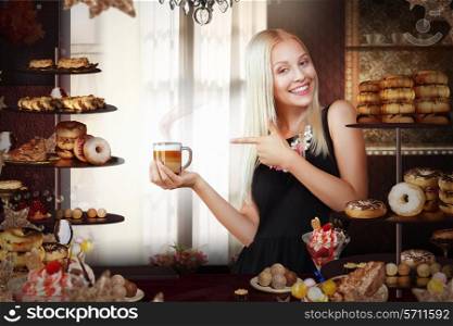 Bakery. Happy Saleswoman with Cup of Coffee in Bakeshop