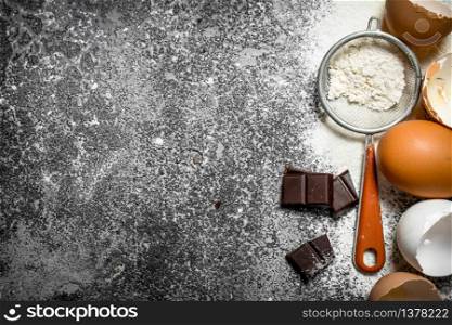 Baking background. Ingredients for biscuits on a rustic background.