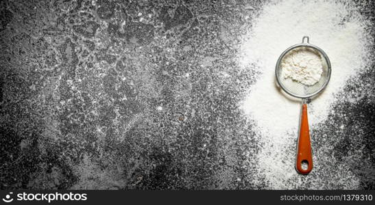 Baking background. Sieve sifted flour. On rustic background. Baking background. Sieve sifted flour.