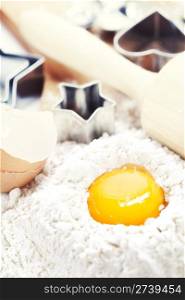 Baking cookies: eggs, flour and baking forms