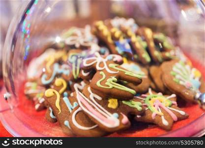 baking, cooking, and food concept - glazed christmas gingerbread. glazed christmas gingerbread