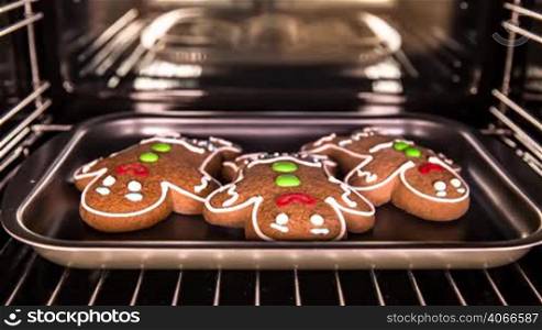 Baking Gingerbread man in the oven. Cooking in the oven.