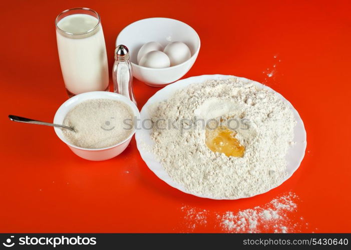 Baking ingredients: eggs, flour, sugar, salt and milk