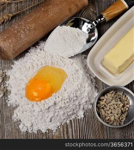 Baking Ingredients :Flour,Eggs,Butter On A Cutting Board