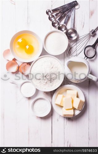 Baking ingredients for pastry on the white table. Baking ingredients