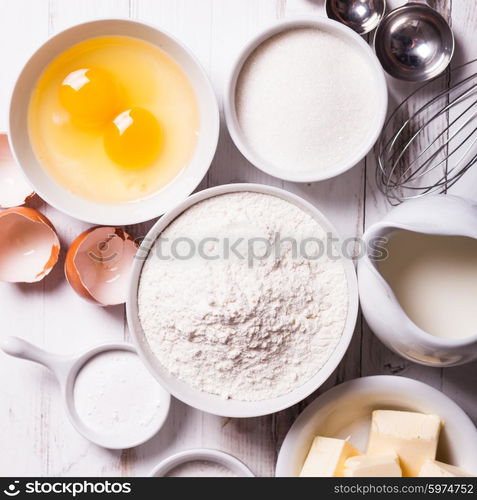 Baking ingredients for pastry on the white table. Baking ingredients