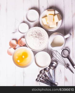 Baking ingredients for pastry on the white table. Baking ingredients on white