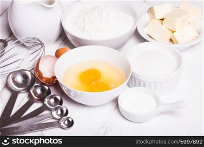 Baking ingredients for pastry on the white table. The baking ingredients