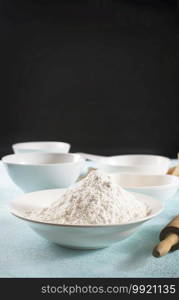 Baking ingredients on a blue table background. Ingredients for baking a cake, cookies or pastry.  Food background