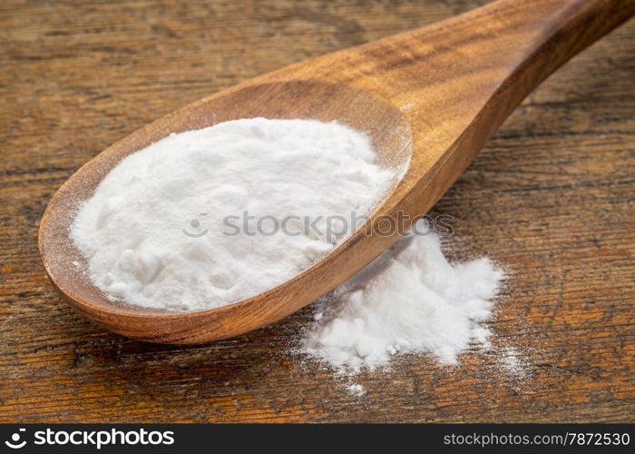 baking soda (Sodium bicarbonate) on a wooden spoon