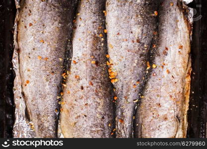 Baking trout on the foil close up