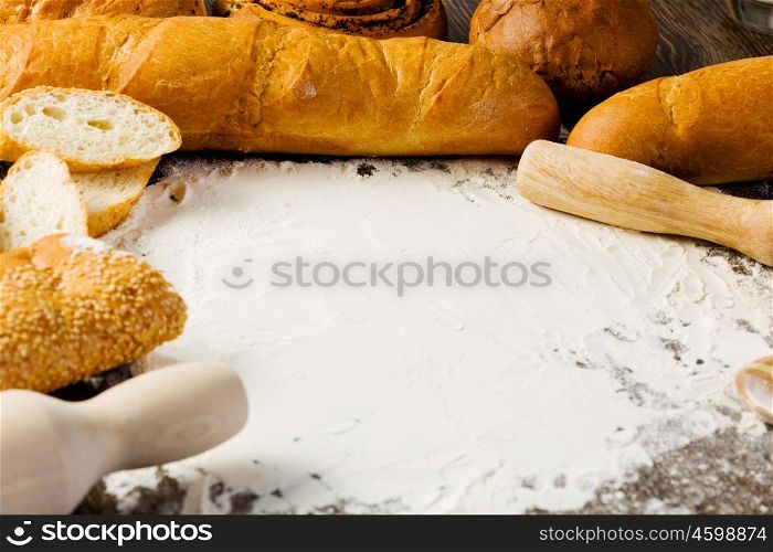 Baking. White bread and flour on kitchen table