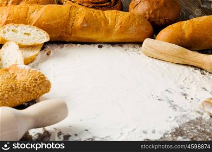 Baking. White bread and flour on kitchen table