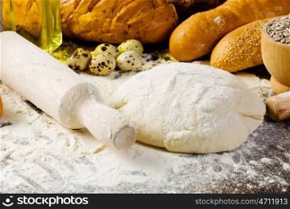 Baking. White bread drought and flour on kitchen table