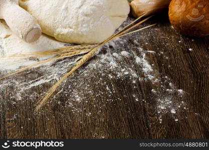 Baking. White bread drought and flour on kitchen table